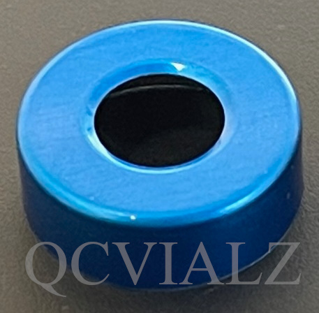 Hole punched vial seals